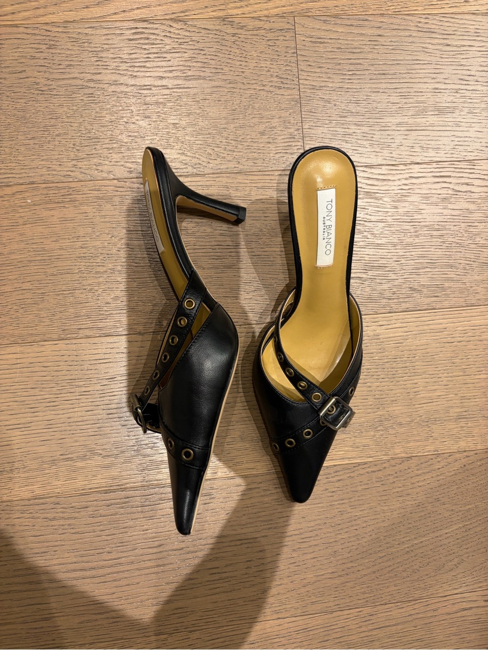 Tony Bianco Black Pointed Buckle Mule Heels with Grommet Trim - Picture 2 of 3